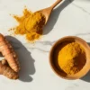 Turmeric benefits shown through fresh roots and golden powder rich in curcumin, highlighting its anti-inflammatory and antioxidant properties.